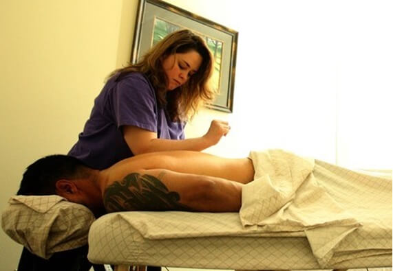 how to report an unlicensed massage therapist